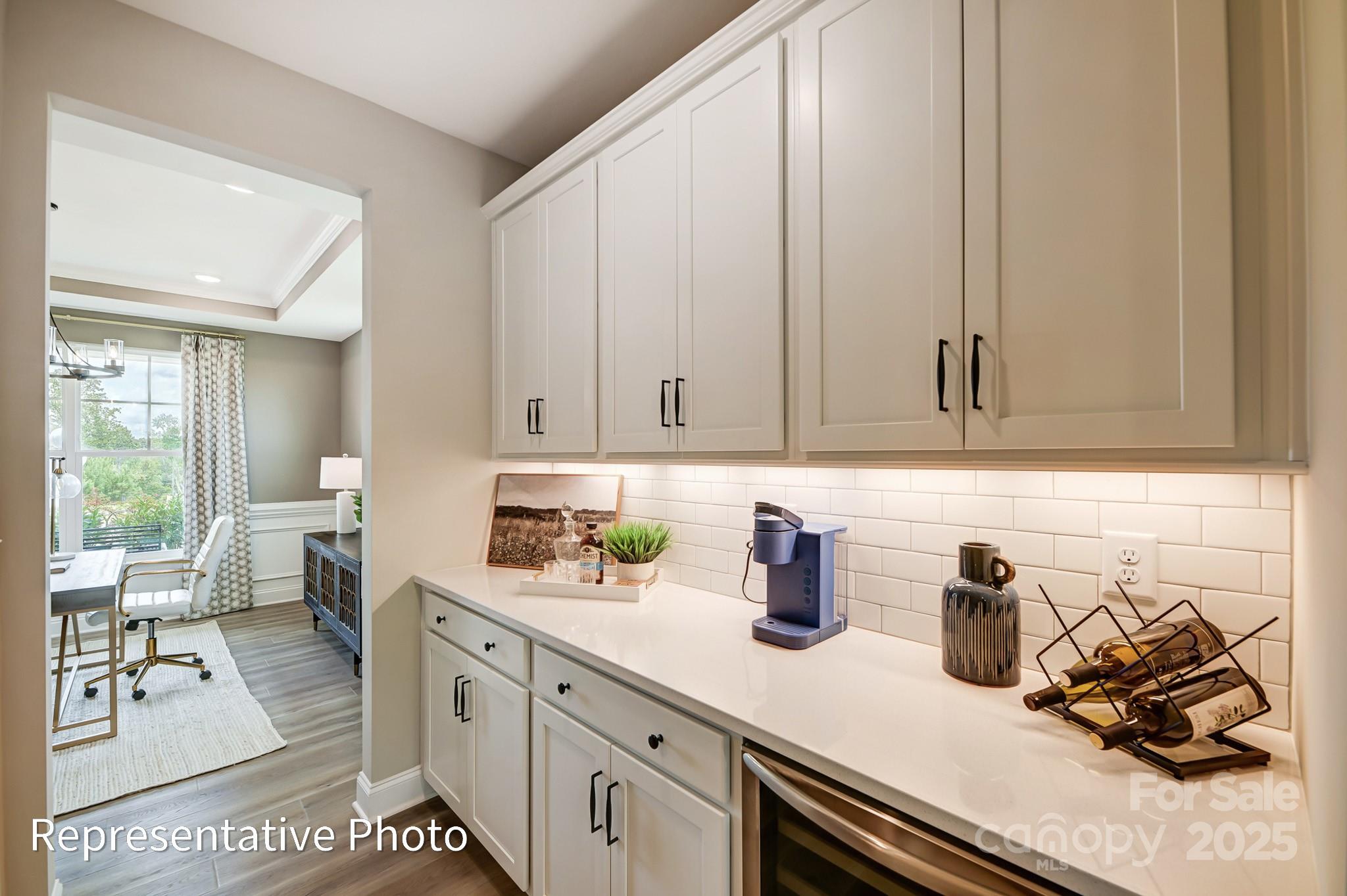 5038 Mclaughlin Loop Waxhaw, NC 28173 - Photo 9 of 25 a kitchen with a sink and cabinets