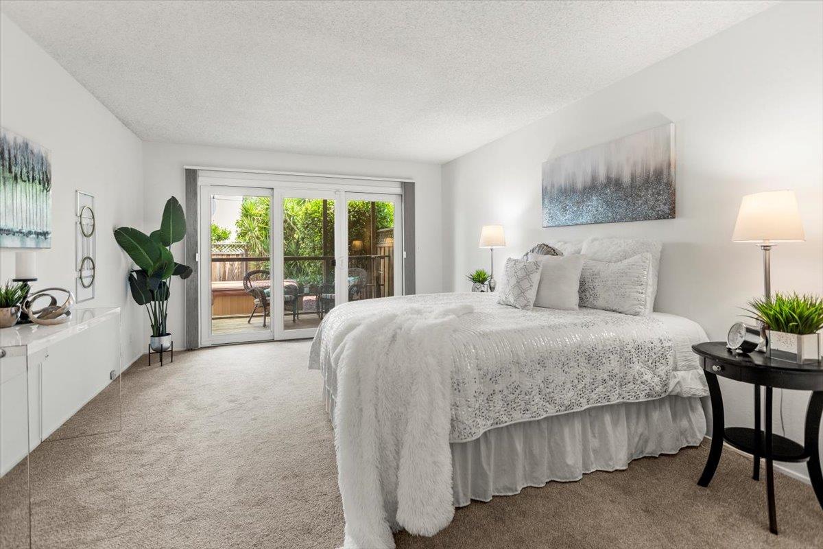 4155 Keith Drive San Jose, CA 95008 - Photo 14 of 28 a spacious bedroom with a large bed and a balcony view