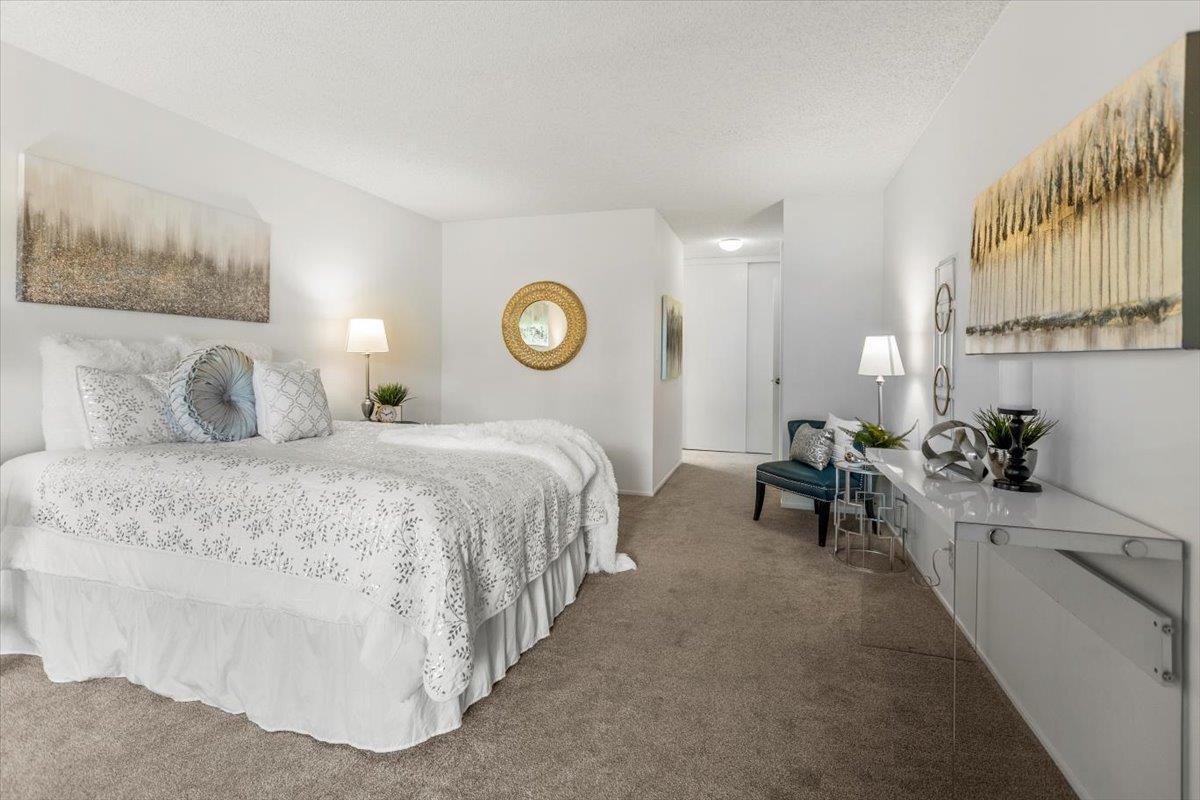 4155 Keith Drive San Jose, CA 95008 - Photo 15 of 28 a bedroom with a bed and a lamp on dresser next to a large window