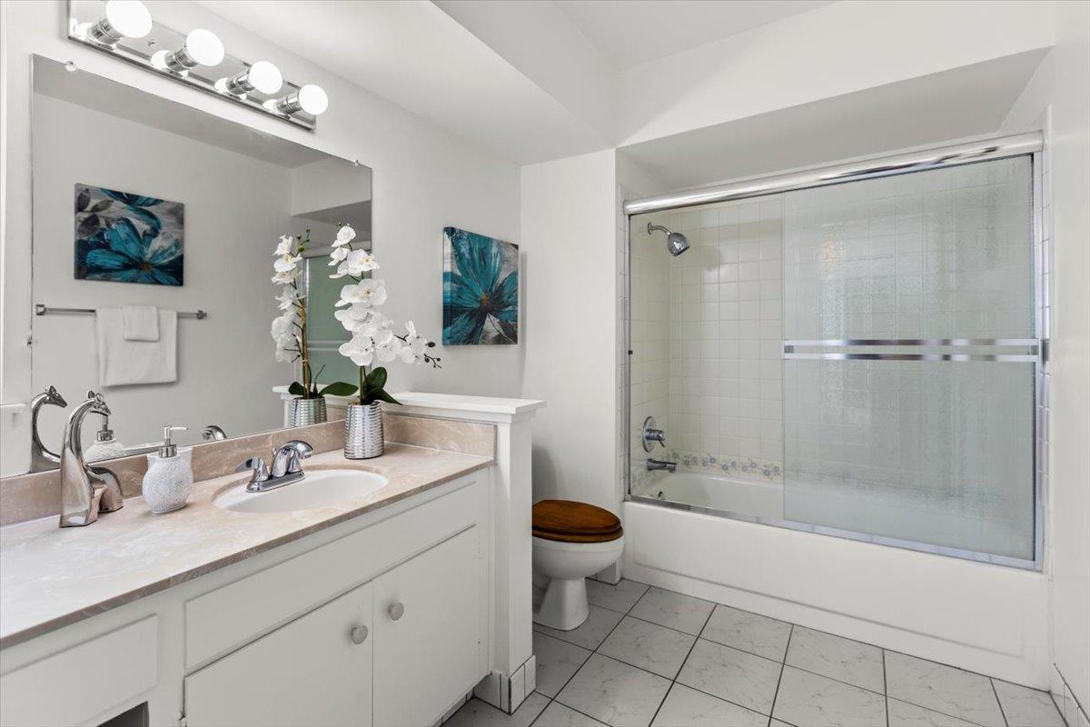 4155 Keith Drive San Jose, CA 95008 - Photo 20 of 28 a bathroom with a double vanity sink toilet and shower