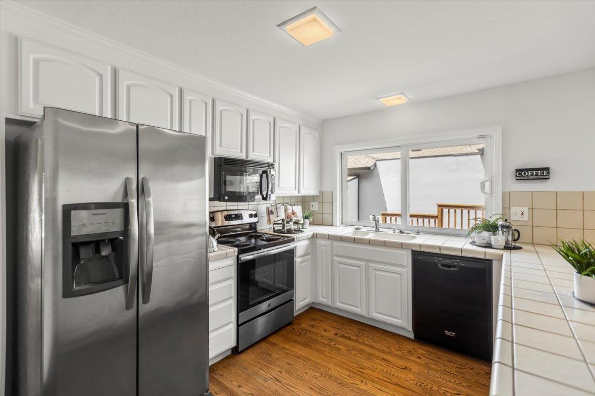 4155 Keith Drive San Jose, CA 95008 - Photo 9 of 28 a kitchen with stainless steel appliances granite countertop a refrigerator a stove and a sink