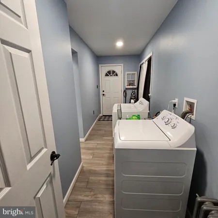 a room with a bed and a mirror