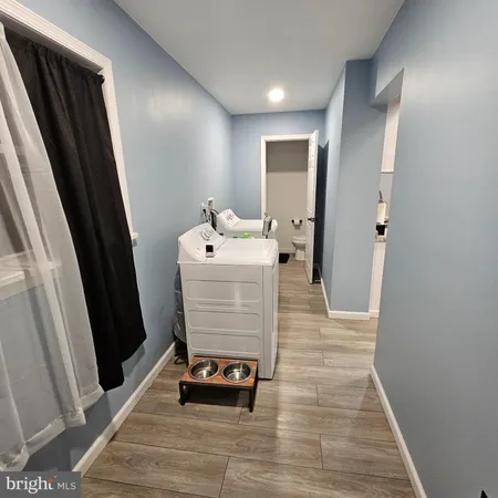 a room with wooden floor and furniture