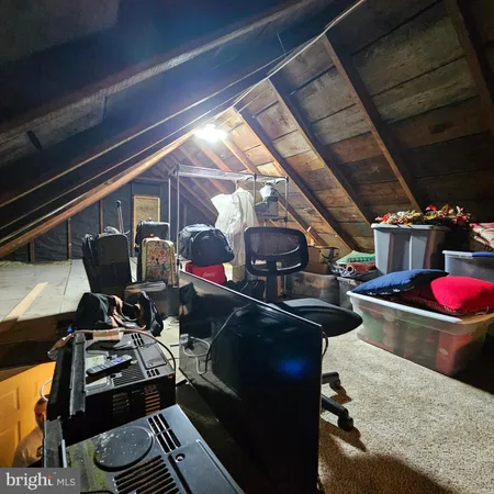 a kitchen with a stove and a wooden floor