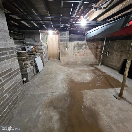 a view of empty room with wooden ceiling