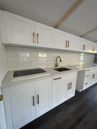 a close view of a sink and dishwasher in a kitchen