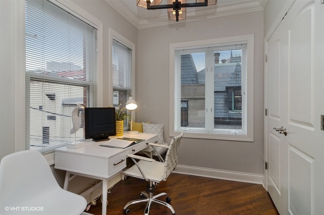 319 East 18th Street Chicago, IL 60616 - Photo 14 of 17 a view of a workspace with furniture and a window