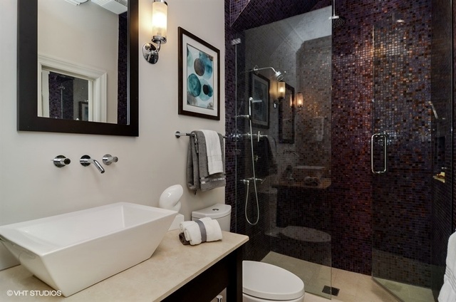 319 East 18th Street Chicago, IL 60616 - Photo 15 of 17 a bathroom with a sink toilet and shower