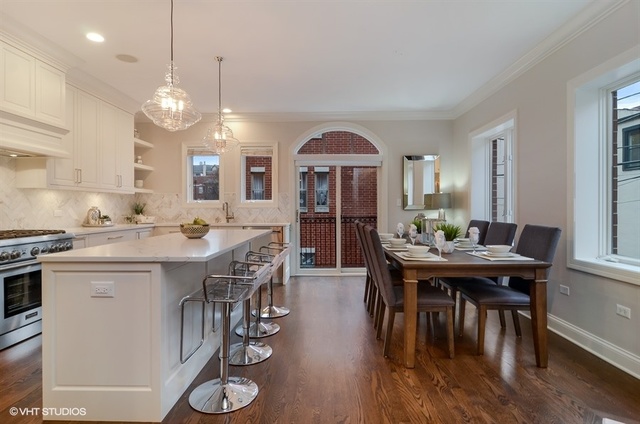 319 East 18th Street Chicago, IL 60616 - Photo 6 of 17 a view of a dining room with furniture window and wooden floor