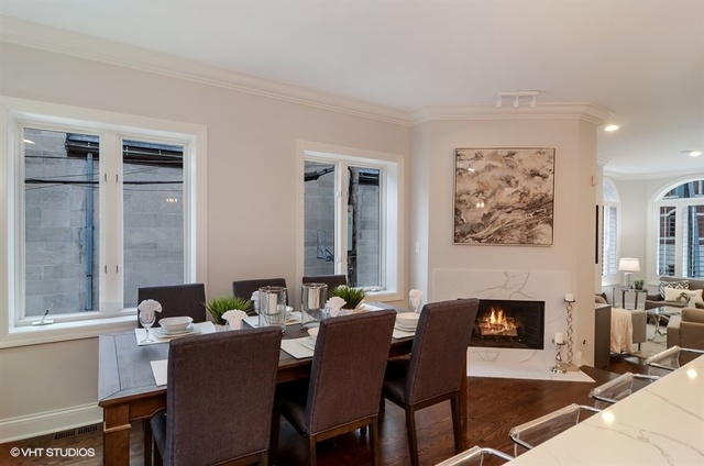 319 East 18th Street Chicago, IL 60616 - Photo 7 of 17 a dining room with furniture and a fireplace