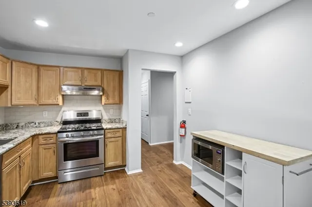 a kitchen with a stove and a microwave