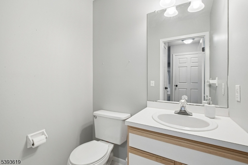 66 Whisper Way East Ledgewood, NJ 07852 - Photo 14 of 38 a bathroom with a sink toilet and mirror