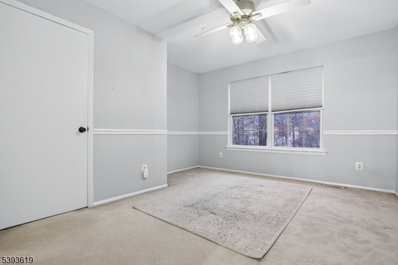 66 Whisper Way East Ledgewood, NJ 07852 - Photo 18 of 38 an empty room with windows and fan