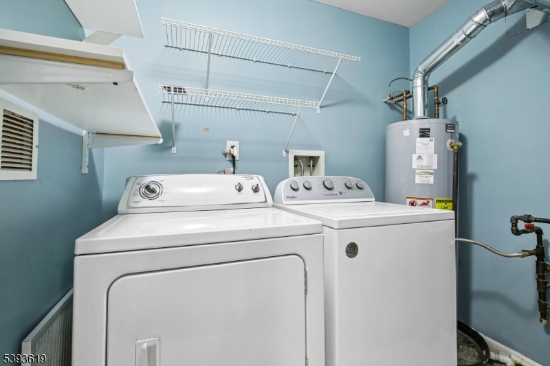 66 Whisper Way East Ledgewood, NJ 07852 - Photo 20 of 38 a utility room with dryer and washer