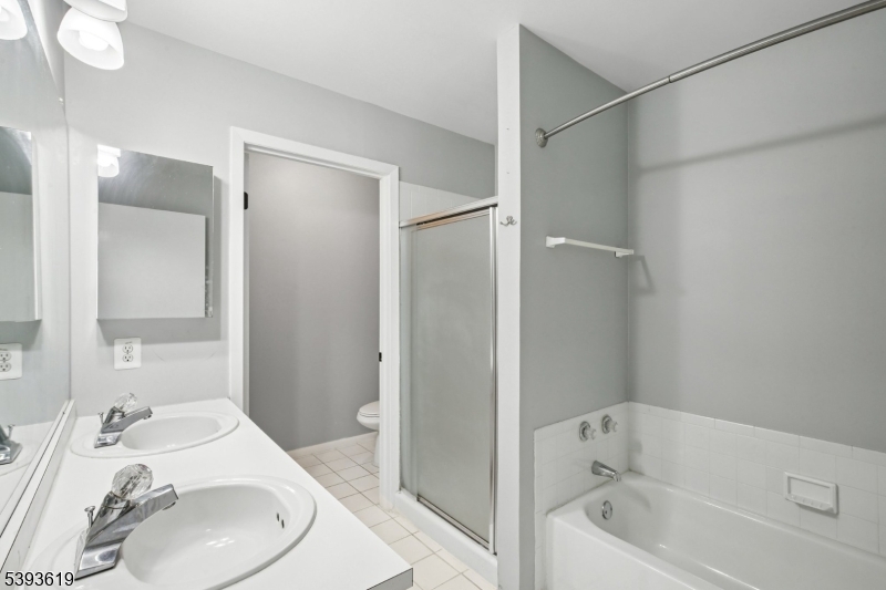 66 Whisper Way East Ledgewood, NJ 07852 - Photo 22 of 38 a bathroom with a sink and a mirror