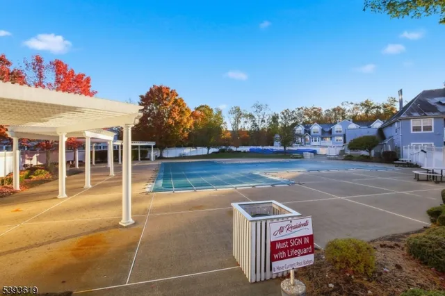 a sign board with parking in back