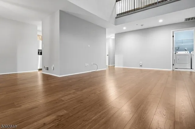 a view of a livingroom with wooden floor