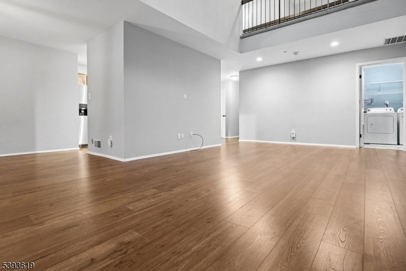 66 Whisper Way East Ledgewood, NJ 07852 - Photo 4 of 38 a view of a livingroom with wooden floor