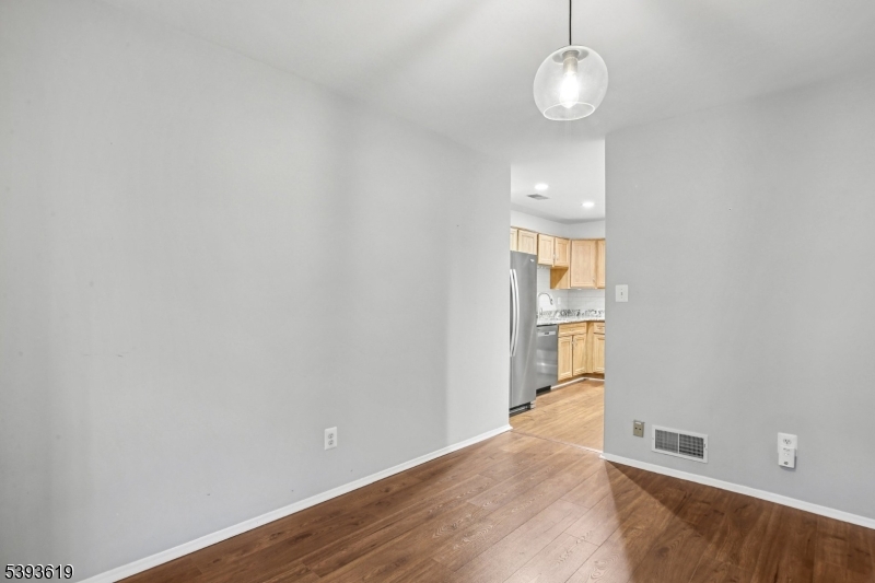 66 Whisper Way East Ledgewood, NJ 07852 - Photo 8 of 38 a view of a room with wooden floor and a large window