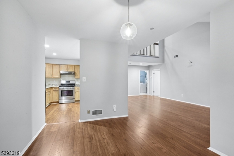 66 Whisper Way East Ledgewood, NJ 07852 - Photo 10 of 38 a view of a kitchen with wooden floor and a kitchen