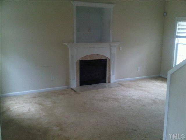 808 Nightshade Way Raleigh, NC 27610 - Photo 2 of 3 a view of empty room with a fireplace