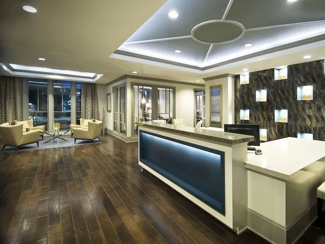 a large kitchen with a table and chairs