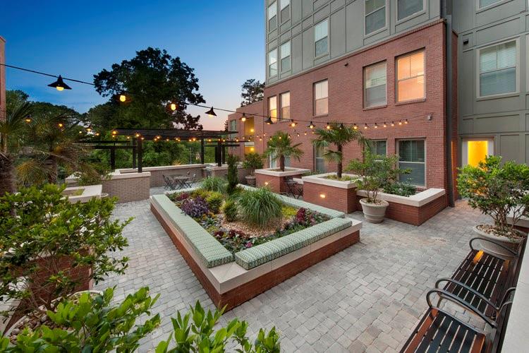 2420 Peachtree Road Northwest, Unit 1205 Atlanta, GA 30305 - Photo 21 of 39 a view of a backyard with plants and outdoor seating
