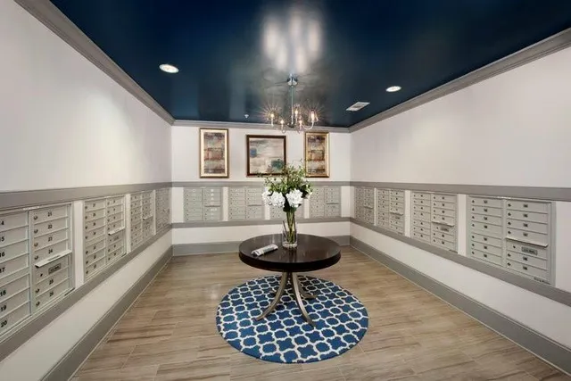 a living room with furniture and a view of kitchen