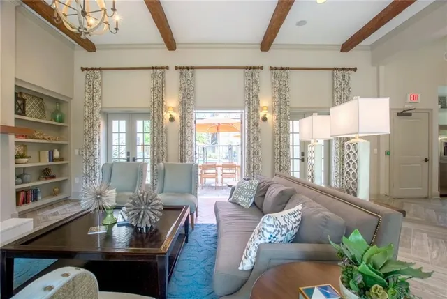 a living room with furniture and a book shelf