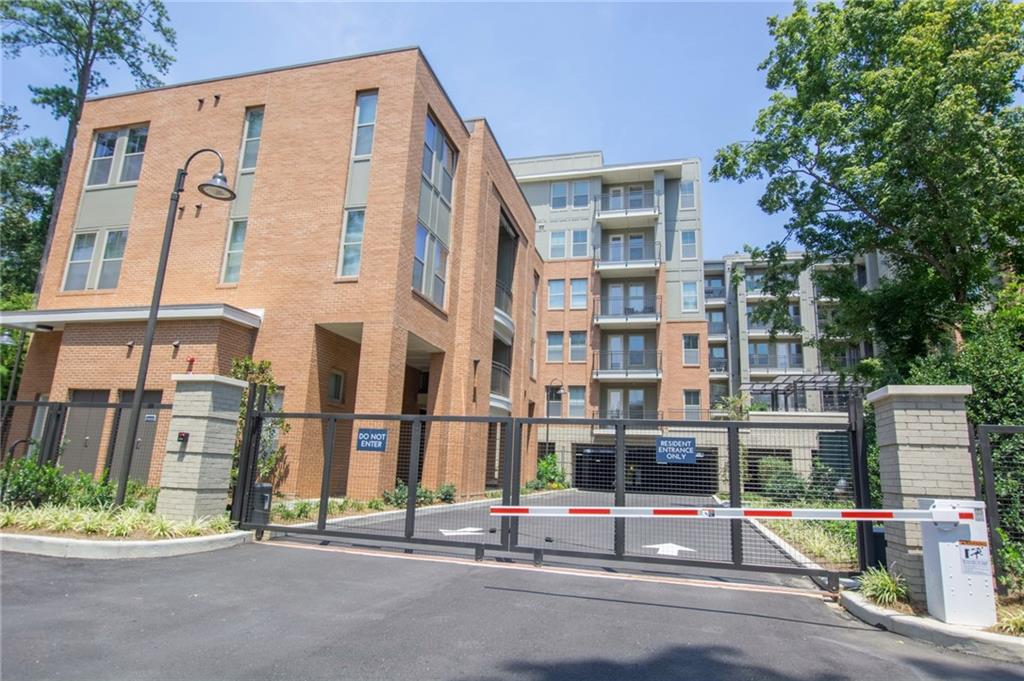 2420 Peachtree Road Northwest, Unit 1205 Atlanta, GA 30305 - Photo 31 of 39 front view of a building with a street