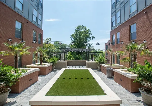 a view of a swimming pool with a patio