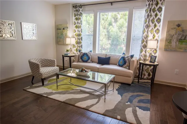 a living room with furniture and a window