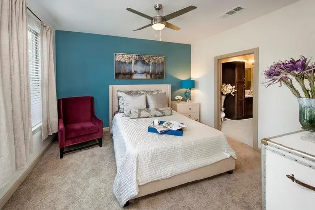 a bedroom with a bed and a couch