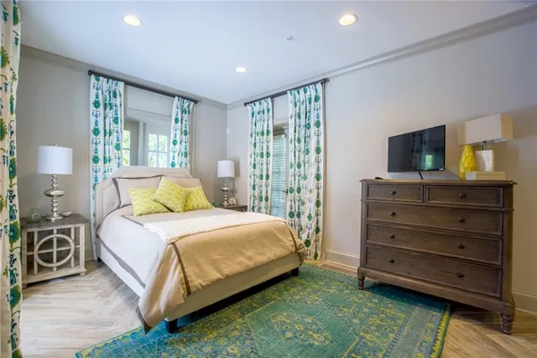 a bedroom with a bed and a dresser