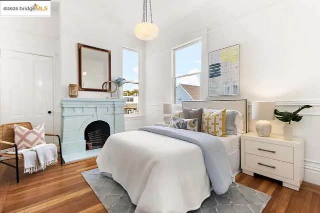 a bedroom with a bed and a fireplace