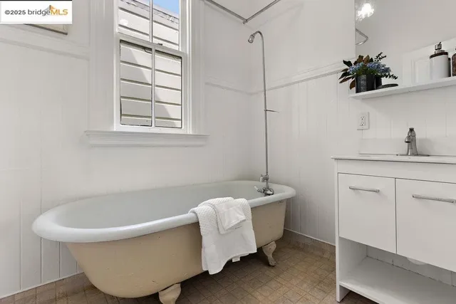 a bathroom with a bathtub and a sink
