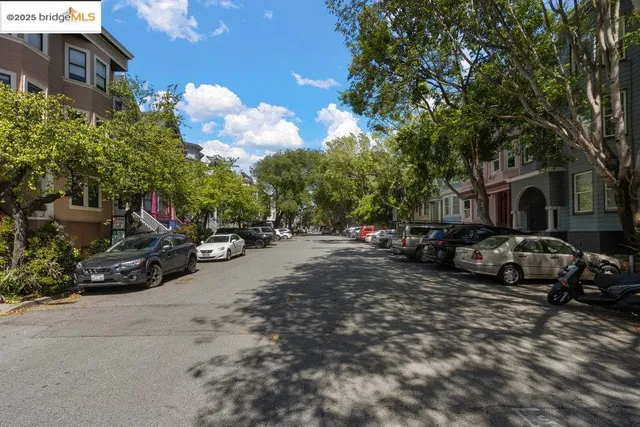 a view of a street with cars on road