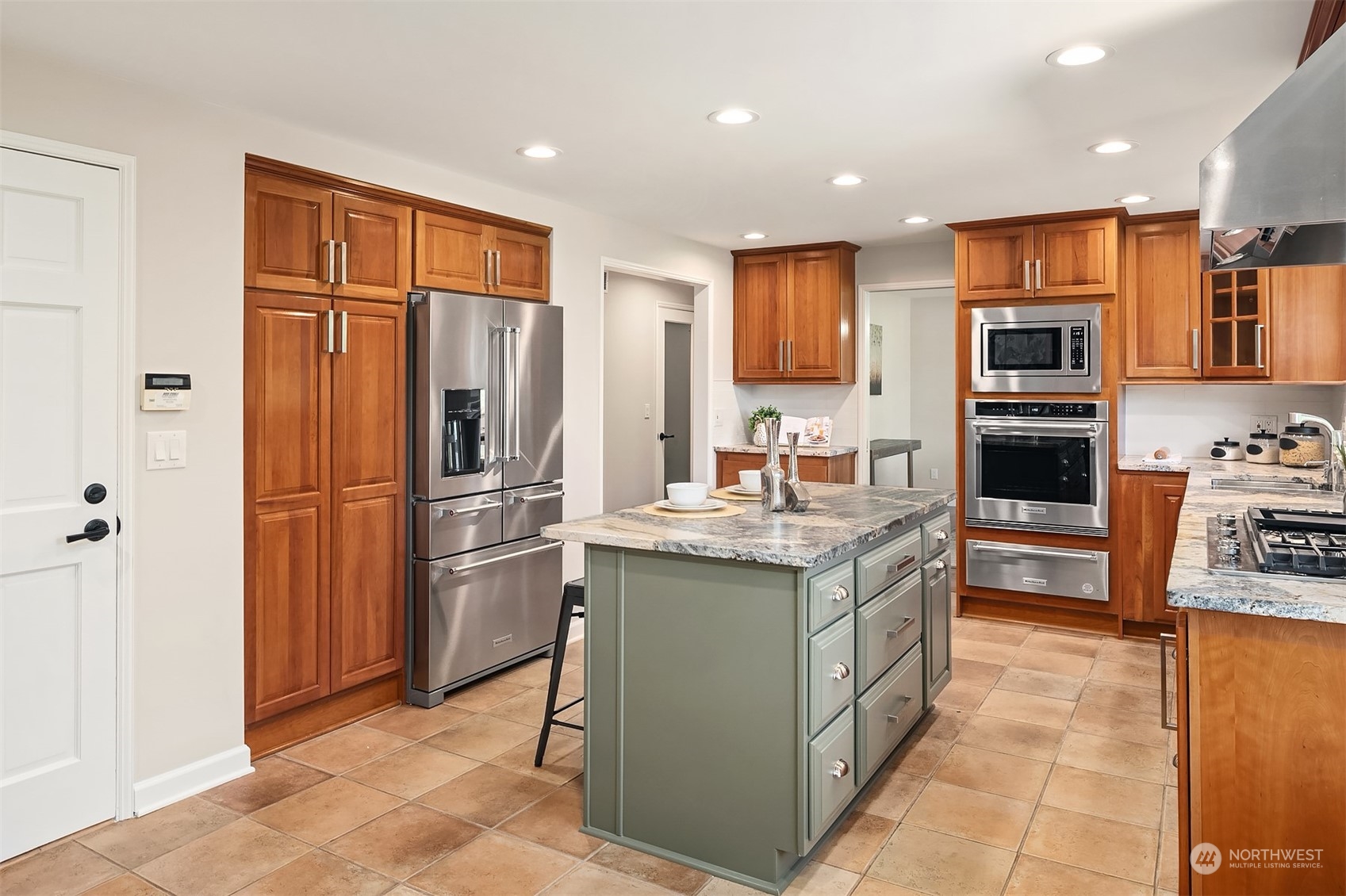 36 Decatur Key Bellevue, WA 98006 - Photo 23 of 40 a kitchen with stainless steel appliances granite countertop a refrigerator and a stove top oven