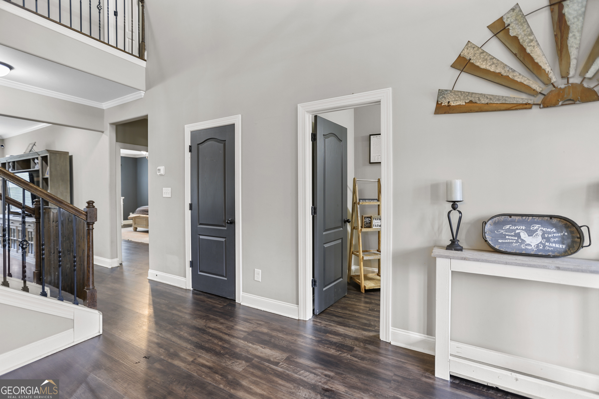 22 Huntsman Run Senoia, GA 30276 - Photo 12 of 69 a view of a hallway with wooden floor and furniture