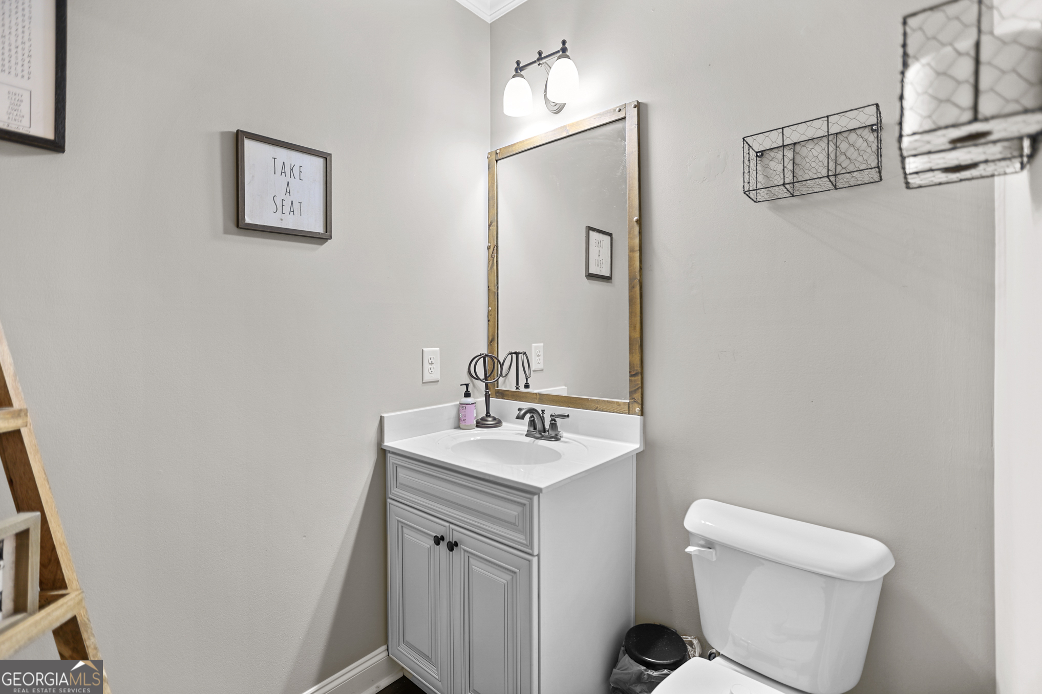 22 Huntsman Run Senoia, GA 30276 - Photo 13 of 69 a bathroom with a toilet sink and mirror