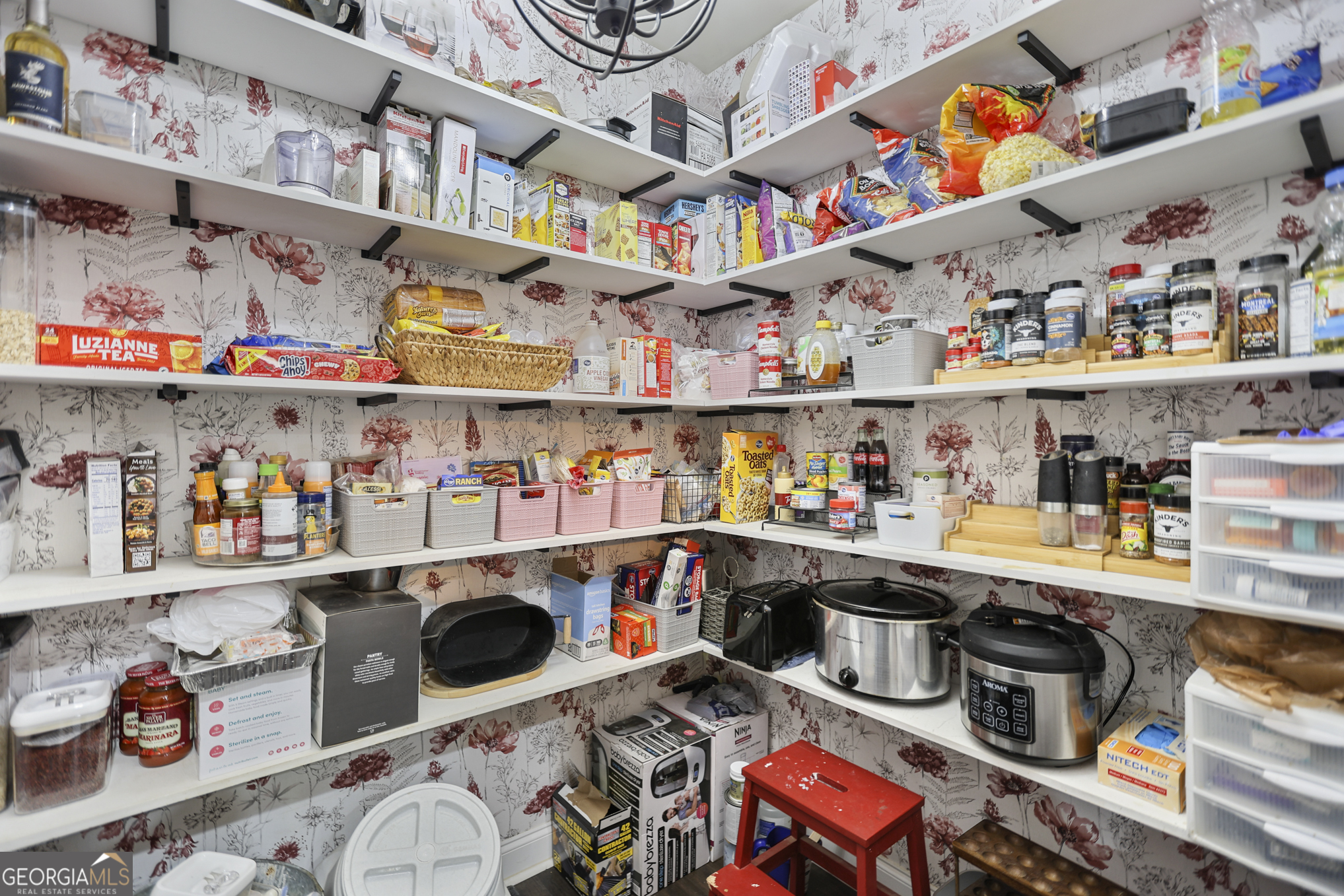 22 Huntsman Run Senoia, GA 30276 - Photo 26 of 69 a room with stainless steel appliances a rug and a book shelf