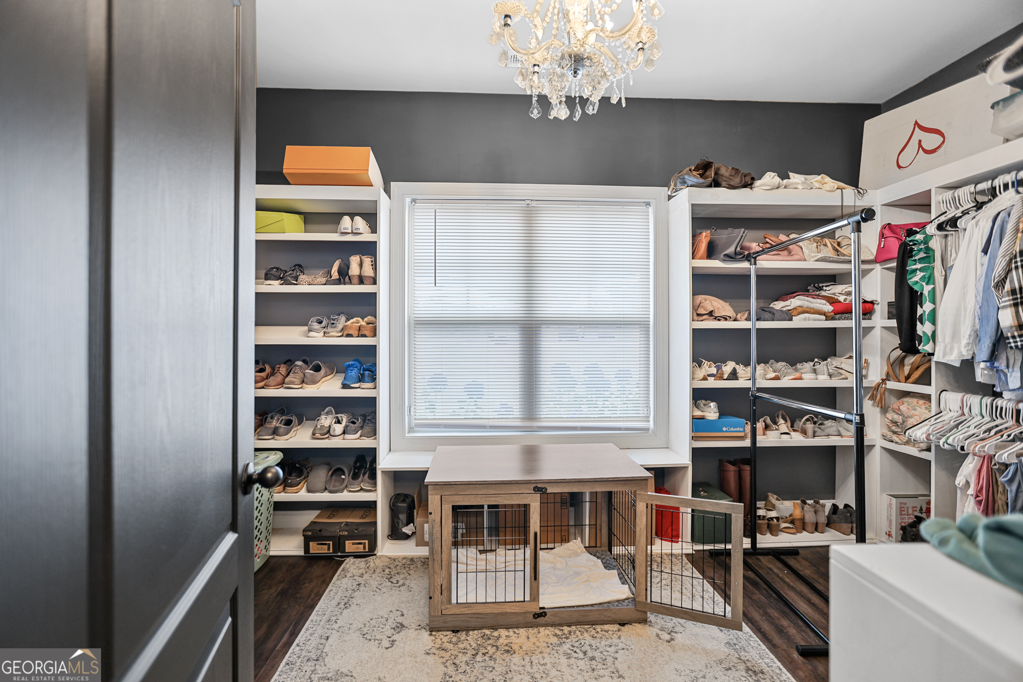 22 Huntsman Run Senoia, GA 30276 - Photo 42 of 69 a view of a dining room with shelves and a chandelier