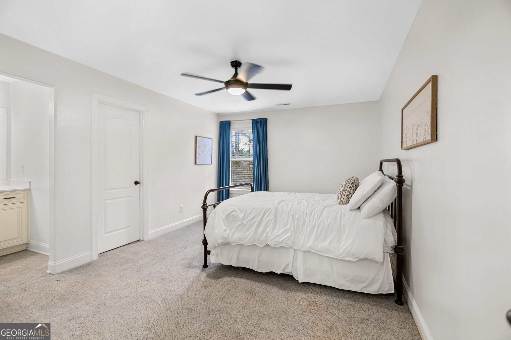 22 Huntsman Run Senoia, GA 30276 - Photo 51 of 69 a bed room with a bed and a ceiling fan