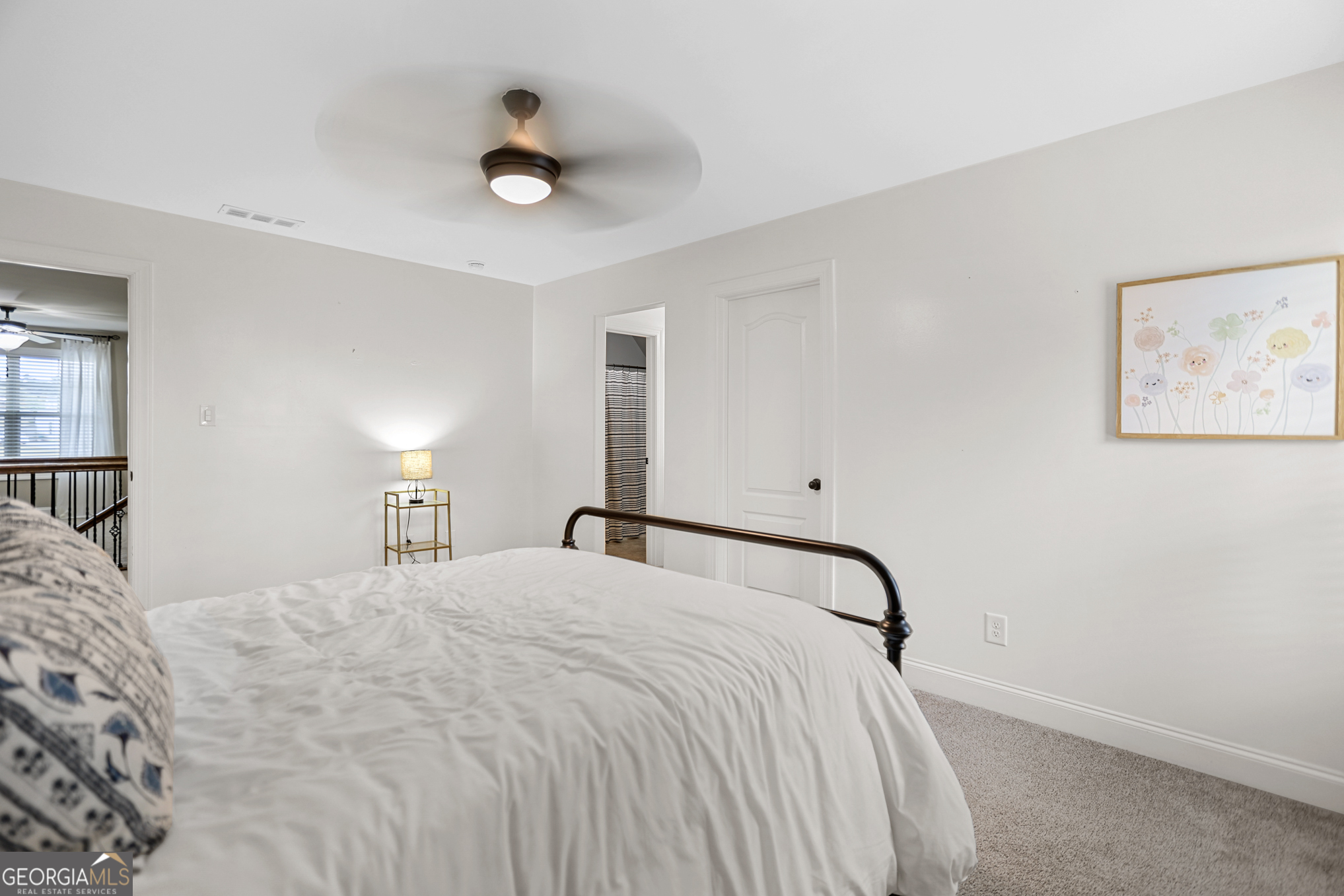 22 Huntsman Run Senoia, GA 30276 - Photo 53 of 69 a bedroom with a bed and a painting on the wall