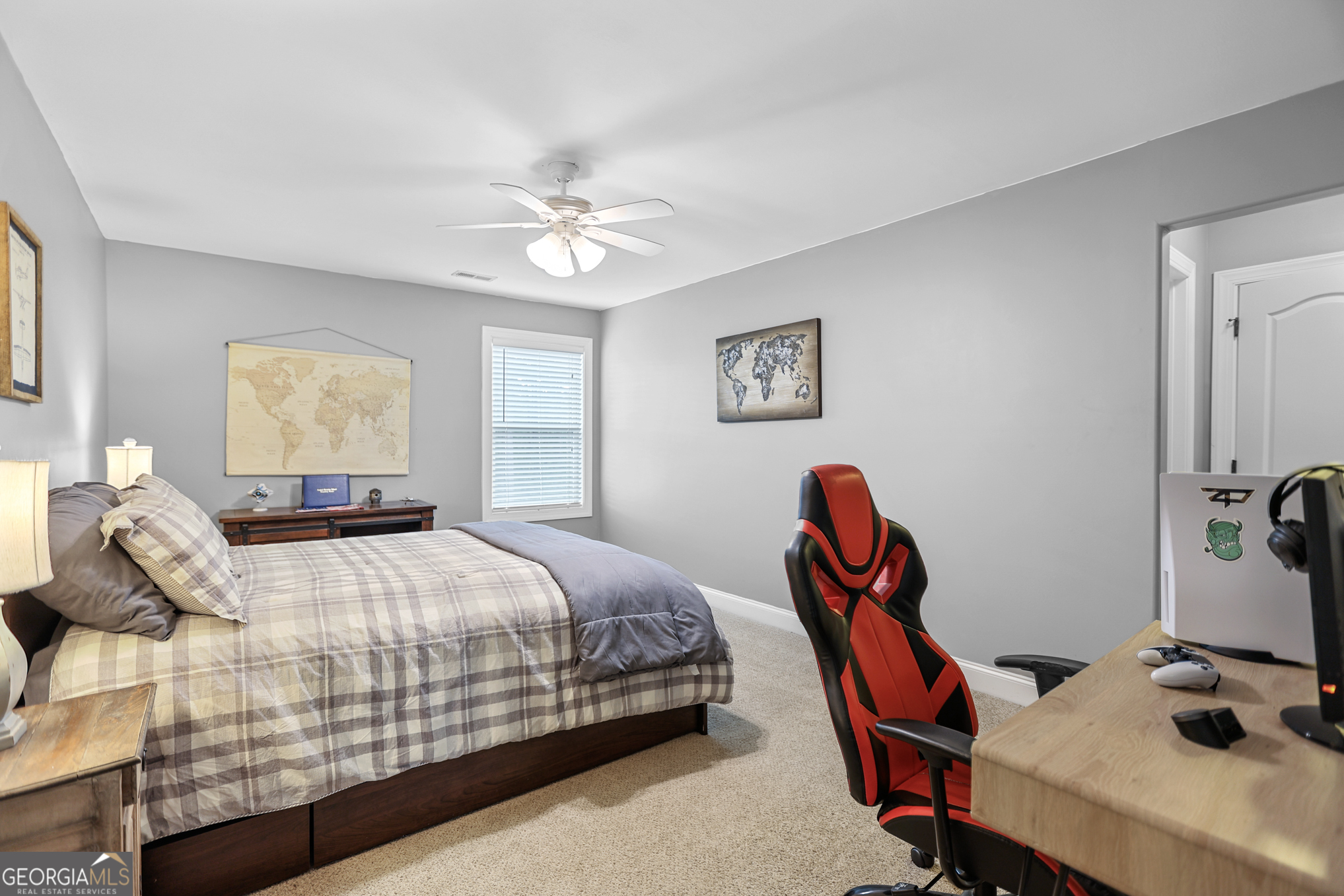 22 Huntsman Run Senoia, GA 30276 - Photo 55 of 69 a bedroom with a bed and a chandelier