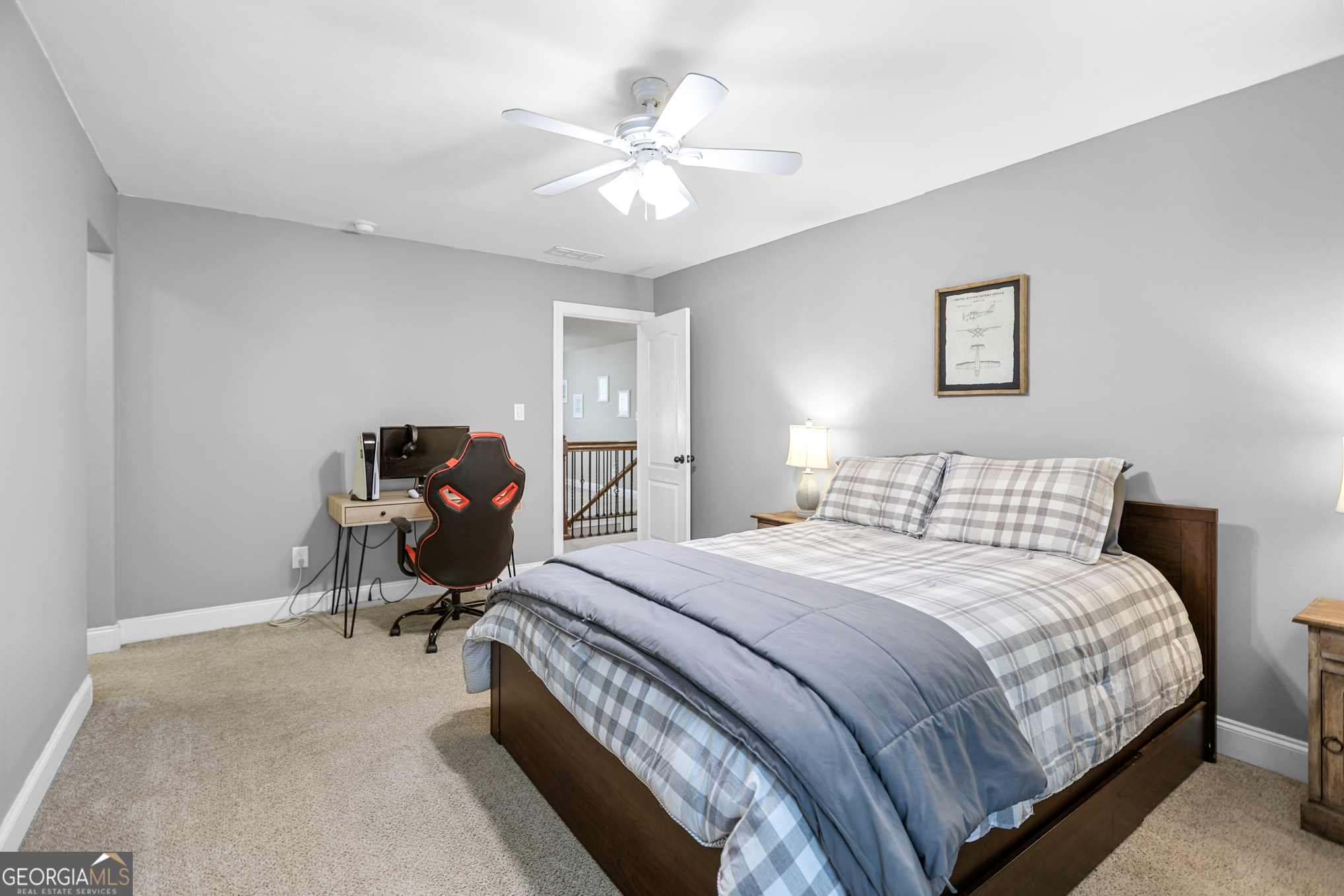 22 Huntsman Run Senoia, GA 30276 - Photo 56 of 69 a bedroom with a bed and a chandelier