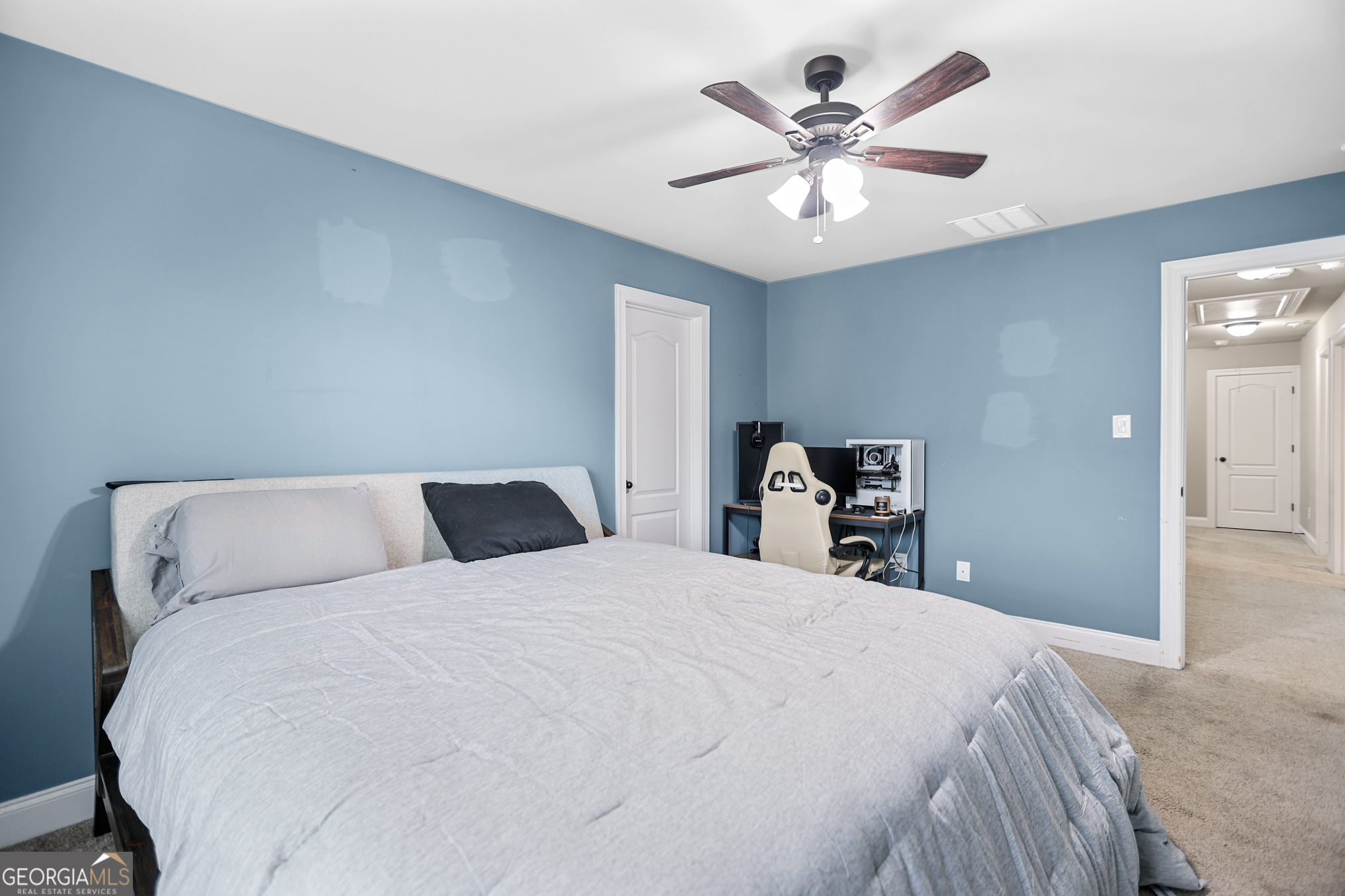 22 Huntsman Run Senoia, GA 30276 - Photo 59 of 69 a bedroom with a bed and ceiling fan