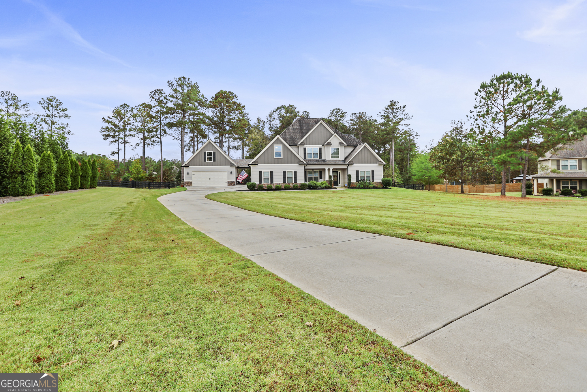 22 Huntsman Run Senoia, GA 30276 - Photo 68 of 69 a front view of a house with a yard and trees