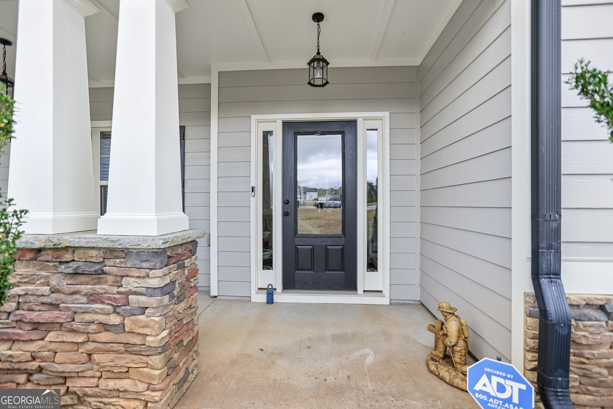 22 Huntsman Run Senoia, GA 30276 - Photo 7 of 69 a bathroom with a granite countertop sink and a mirror