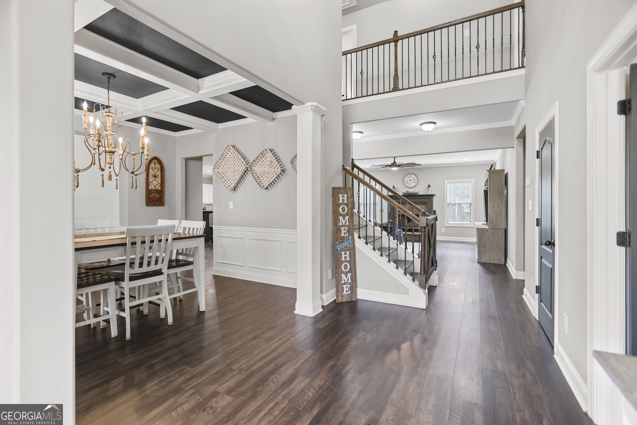 22 Huntsman Run Senoia, GA 30276 - Photo 9 of 69 a view of a hallway with wooden floor and staircase